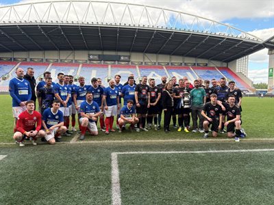 Group of men inside a football stadium