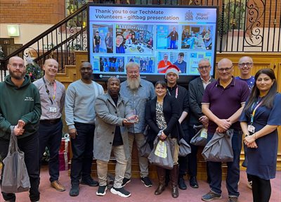 Digital awards Dec 24 volunteers with assistant director Rob Gregory and Councillor Rehman