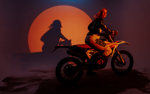 Jane Daniels motorbiking on sand dunes