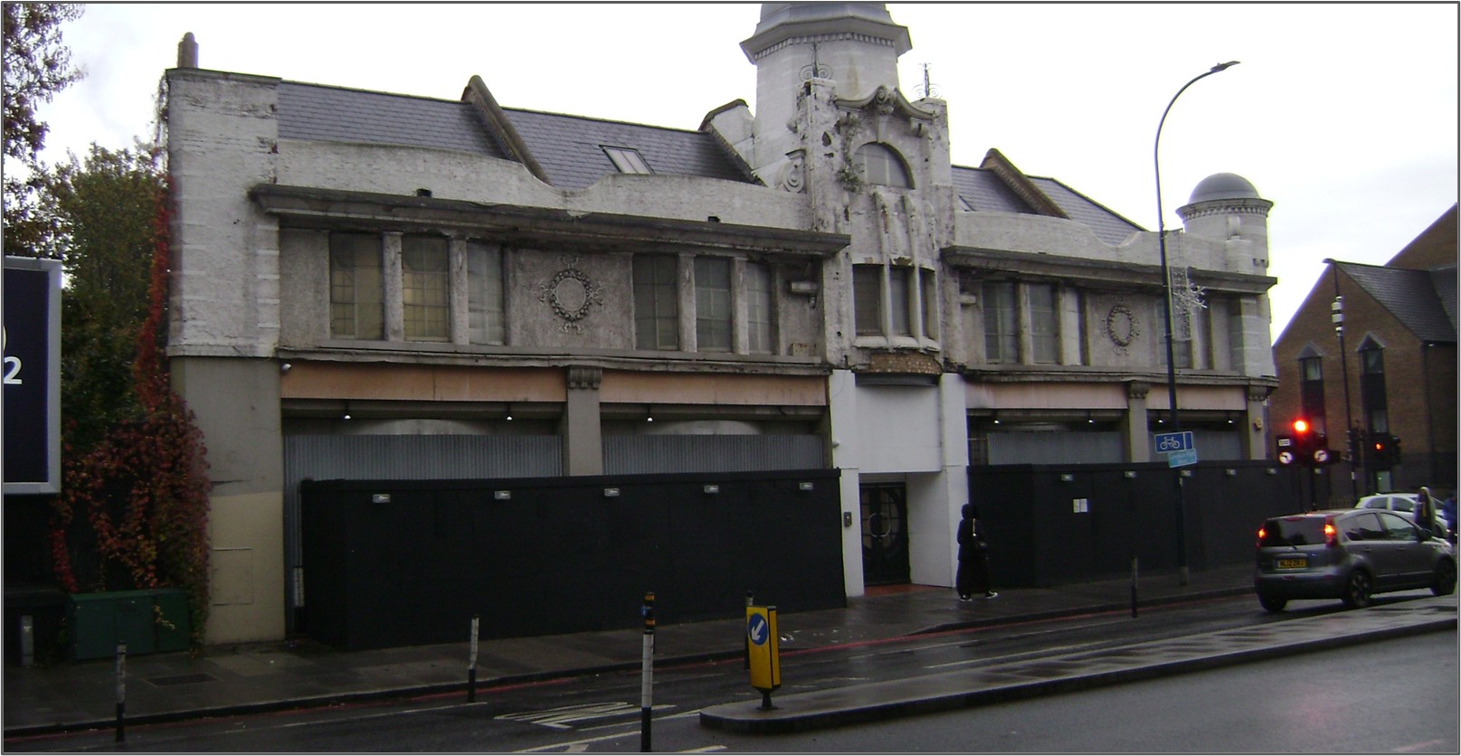 The Temperance Billiard Hall in Lewisham. Stood in front of a road.